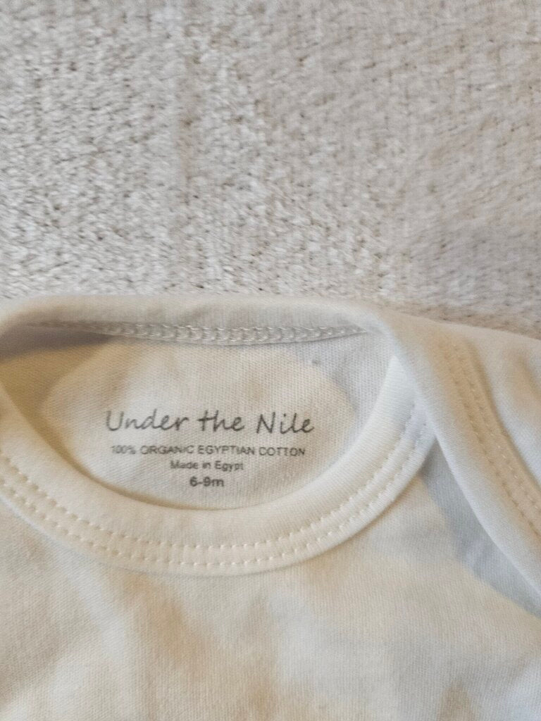 NEW UNDER THE NILE ONESIE